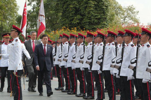 Mongolian Prime Minister Sukhbaatar Batbold, accompanied by Prime Minister Lee Hsien Loong, inspecting guard of honour during ceremonial welcome at Istana