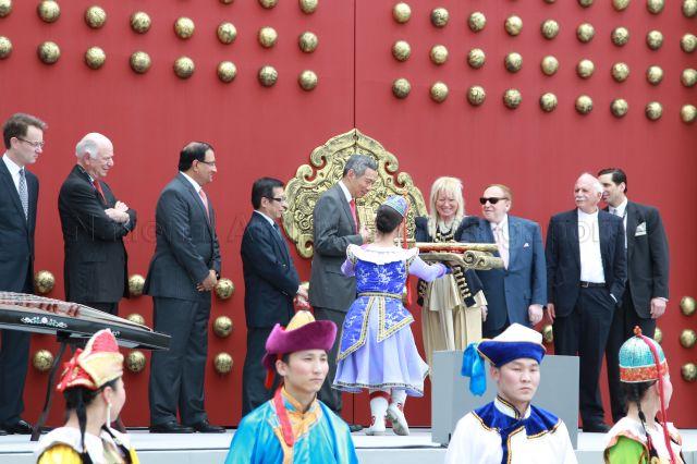 Prime Minister Lee Hsien Loong receiving a giant gold key to open ceremonial gate to ArtScience Museum during its official opening which marks the grand opening of Marina Bay Sands