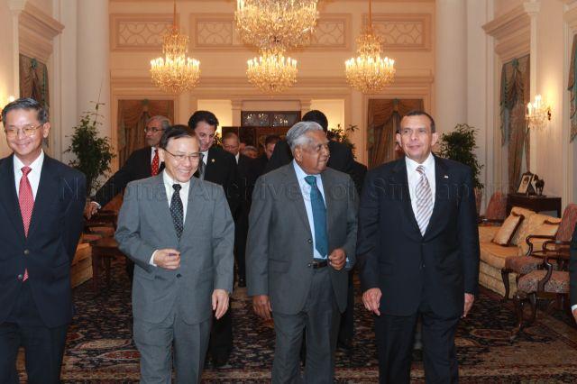Honduran President Porfirio Lobo Sosa, accompanied by President S R Nathan, leaving the Istana building after a luncheon given in his honour. With them is Senior Minister of State for Law and Home Affairs Associate Professor Ho Peng Kee (second from left).