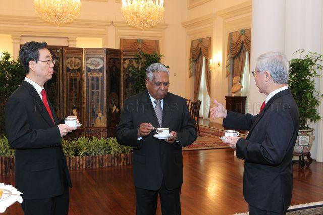 President S R Nathan chatting with Justice Andrew Ang (left) and Chief Justice Chan Sek Keong (right) after the swearing-in of Justice Ang at West Drawing Room, Istana