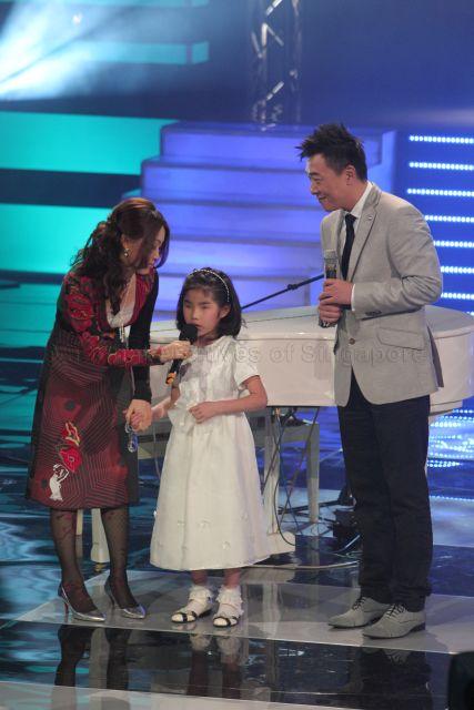 Host for the show Guo Liang with eight-year-old Korean child pianist with a visual impairment Yoo Ye Eun at Society for the Physically Disabled (SPD)'s charity show held at Mediacorp television auditorium