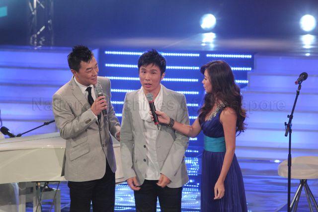 Hosts for the show Guo Liang and Michelle Chia with Kelvin Tan Wei Lian, a visually impaired Singaporean singer, at Society for the Physically Disabled (SPD)'s charity show held at Mediacorp television auditorium