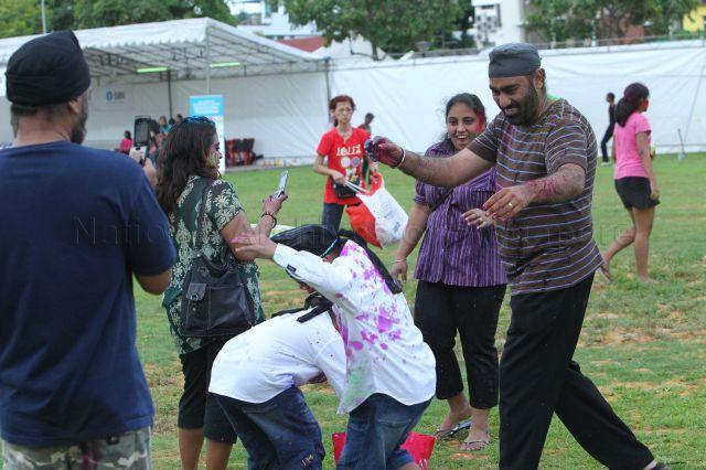 Residents celebrating Holi Hungama, an Indian festival to mark the advent of spring, with a splash of colour, at open field next to Kembangan Mass Rapid Transit (MRT) station. The event was jointly organised by Bhojpuri Society (Singapore ), Indian Activity Executive Communities (IAECs) of Marine Parade Group Representation Constituency (GRC), MacPherson and Potong Pasir.