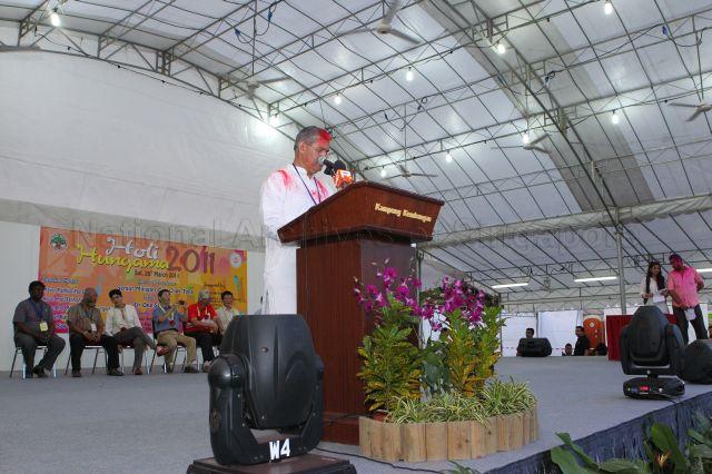 President of Bhojpuri Society (Singapore) Sri Sugrim Misir speaking at Holi Hungama, an Indian festival to mark the advent of spring, held at open field next to Kembangan Mass Rapid Transit (MRT) station. Among those seated on stage is Senior Minister Goh Chok Tong.
