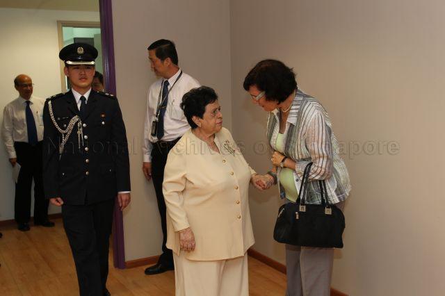 Mrs S R Nathan speaking to Dr Sheryn Mah, wife of Minister for National Development Mah Bow Tan, during official opening of new premises of St Andrew's Autism Centre at No. 1 Elliot Road