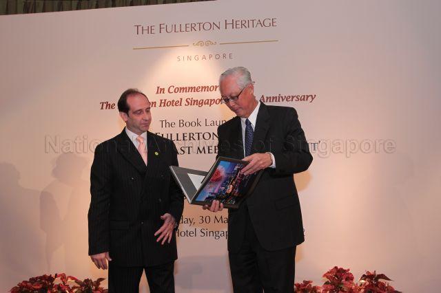 Senior Minister Goh Chok Tong browsing through the coffee table book "The Fullerton Heritage: Where the Past Meets the Present" at launch of the publication during 10th anniversary celebration of Fullerton Hotel Singapore held at Ballroom 2, Fullerton Hotel. Looking on is General Manager of Fullerton Hotel Singapore Giovanni Viterale.