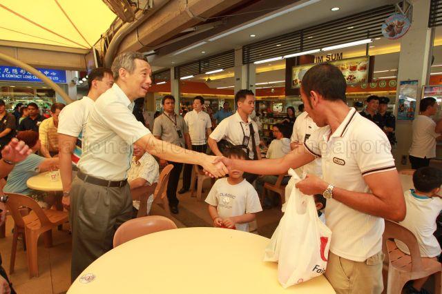 Prime Minister Lee Hsien Loong touring Koufu food court in Fernvale Point during Sengkang West Wellness Day