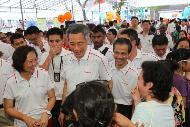 Taken at: Nee South South Community Day 2011 cum Opening of Active Park next to Block 832 along Yishun Street 81 Pictured: Guest-of-Honour Prime Minister Lee Hsien Loong, Member of Parliament for Ang Mo Kio GRC Lee Bee Wah, Member of Parliament for Marine Parade GRC Muhammad Faishal Ibrahim (partially hidden) and People's Action Party member Patrick Tay