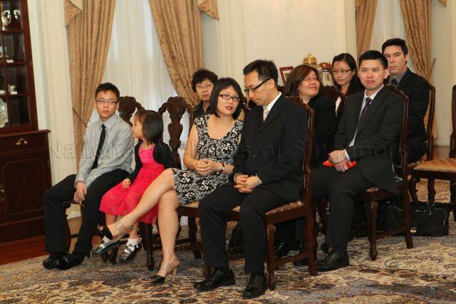 Mr Chan Heng Kee (front row, right) with family members at Istana where he is to be sworn in as Permanent Secretary to Ministry of Community Development, Youth and Sports (MCYS)