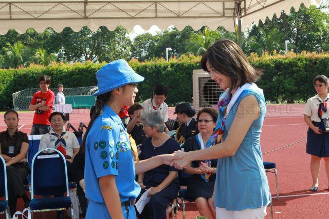 President of Girl Guides Singapore Mrs Joy Balakrishnan, wife of Minister for Community Development, Youth and Sports Dr Vivian Balakrishnan, presenting Puan Noor Aishah (PNA) gold awards for Guide Units during Girl Guides centenary celebrations at Bishan Sports Stadium located at No. 7 Bishan Street 14