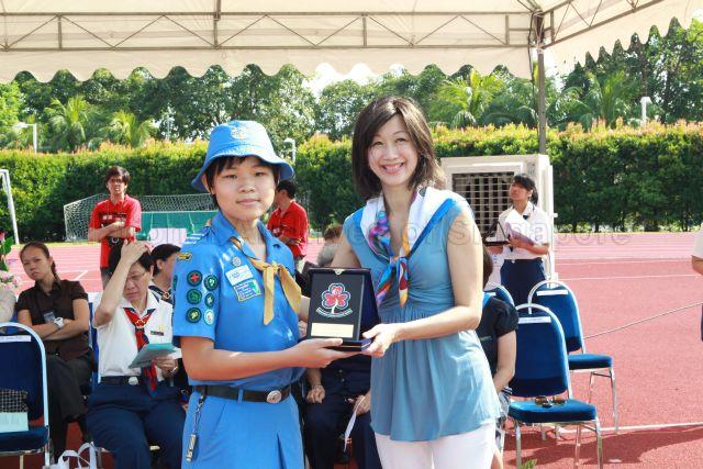 President of Girl Guides Singapore Mrs Joy Balakrishnan, wife of Minister for Community Development, Youth and Sports Dr Vivian Balakrishnan, presenting Puan Noor Aishah (PNA) gold awards for Guide Units during Girl Guides centenary celebrations at Bishan Sports Stadium located at No. 7 Bishan Street 14