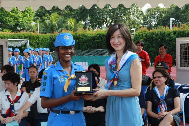 President of Girl Guides Singapore Mrs Joy Balakrishnan, wife of Minister for Community Development, Youth and Sports Dr Vivian Balakrishnan, presenting Puan Noor Aishah (PNA) gold awards for Guide Units during Girl Guides centenary celebrations at Bishan Sports Stadium located at No. 7 Bishan Street 14