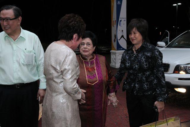 Mrs S R Nathan, wife of the President, being greeted by Chief Executive Officer of National Kidney Foundation (NKF) Mrs Eunice Tay (back to camera) upon arrival at Orchid Country Club to attend NKF's 100-table charity dinner. On the left is NKF Chairman Gerard Ee.