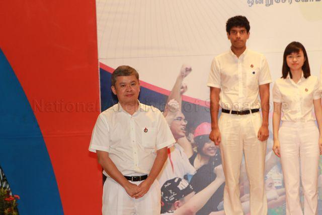 Introduction of new People's Action Party (PAP) candidate for Ang Mo Kio Group Representation Constituency (GRC) in the forthcoming general election Ang Hin Kee during 25th Anniversary Rally of Young PAP (YP) at NTUC Centre auditorium in Marina Boulevard. On the right are new PAP candidates Ms Tin Pei Ling and Vikram Nair.