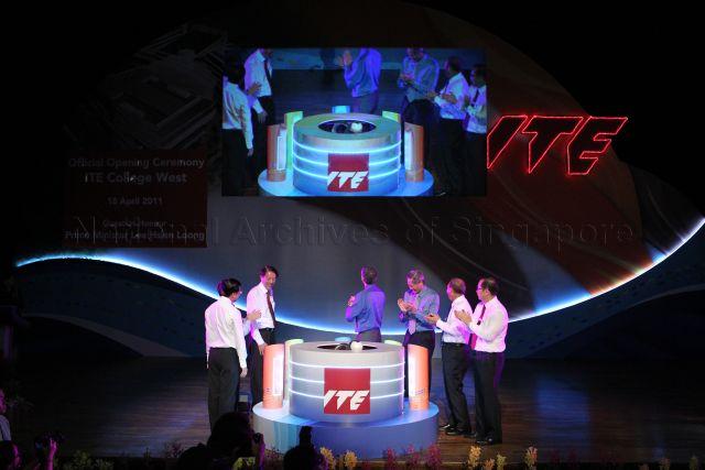 Prime Minister Lee Hsien Loong (back to camera) with, from left, Director and Chief Executive Officer of Institute of Technical Education (ITE) Bruce Poh Geok Huat, Minister for Manpower Gan Kim Yong (hidden), Deputy Prime Minister and Minister for Defence Teo Chee Hean, Minister for Education and Second Minister for Defence Dr Ng Eng Hen, Chairman of ITE Board of Governors Bob Tan Beng Hai and Principal of ITE College West Dr Yek Tiew Ming at unveiling ceremony of the alpha.infinity sculpture during official opening of ITE College West in Choa Chu Kang Grove