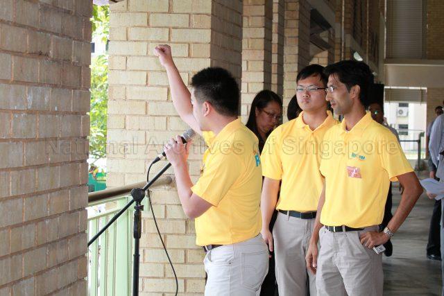 General Election 2011 - Reform Party (RP) candidate for Ang Mo Kio Group Representation Constituency (GRC) Lim Zirui addressing supporters at Deyi Secondary School in Ang Mo Kio Street 42, the nomination centre for electoral divisions of Ang Mo Kio, Aljunied, Bishan-Toa Payoh and Sengkang West. With him are fellow RP candidates for Ang Mo Kio GRC Tan Zhi Xiang and Osman bin Sulaiman.
