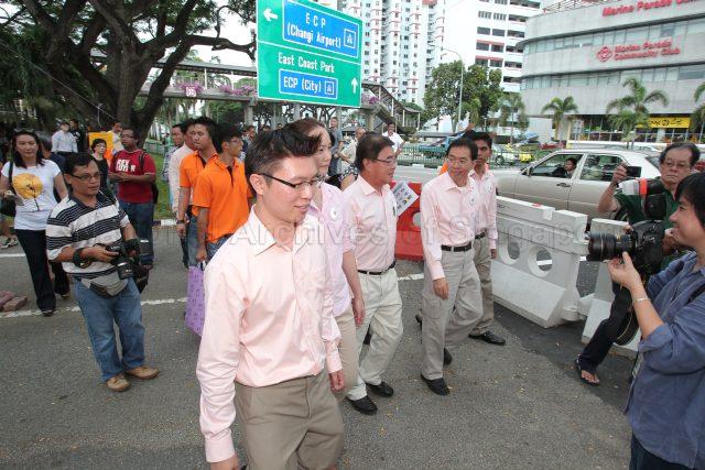 General Election 2011 - National Solidarity Party (NSP) candidates for Marine Parade Group Representation Constituency (GRC), from left, Spencer Ng Chung Hon, Ms Nicole Seah (partially hidden), Ivan Yeo Tiong Boon, Cheo Chai Chen and Abdul Salim Harun (partially hidden) at the street along Tao Nan School, 49 Marine Crescent, the nomination centre for electoral divisions of Marine Parade GRC, Potong Pasir, Joo Chiat and Mountbatten