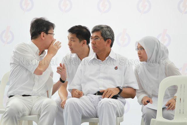 People's Action Party (PAP) candidates (from right) Dr Intan Azura Mokhtar, Associate Professor Dr Yaacob Ibrahim, Brigadier-General Tan Chuan-Jin and Lim Swee Say at PAP lunchtime election rally held at Boat Quay next to UOB Plaza