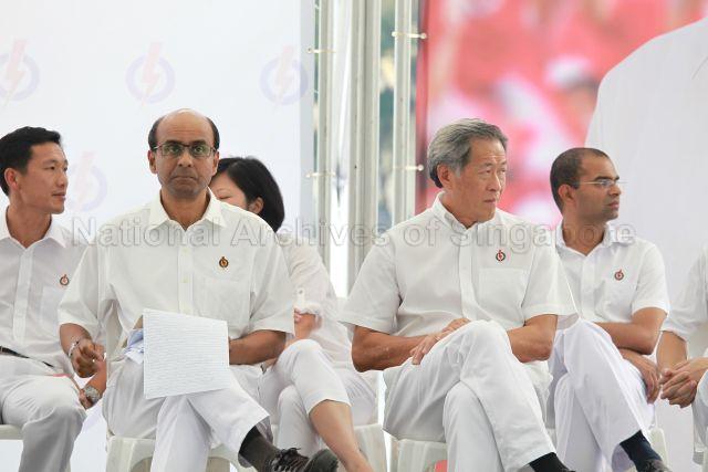 People's Action Party (PAP) candidates (from right) Dr Janil Puthucheary, Dr Ng Eng Hen, Ms Sim Ann (partially hidden), Tharman Shanmugaratnam and Ong Ye Kung at PAP lunchtime election rally held at Boat Quay next to UOB Plaza