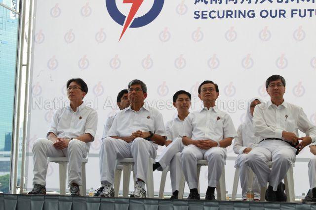 Chairman of People's Action Party (PAP) Lim Boon Heng (right) with PAP candidates (front row, from left) Lim Swee Say, Associate Professor Dr Yaacob Ibrahim and Wong Kan Seng; (back row, from left) Vikram Nair, Brigadier-General Tan Chuan-Jin and Dr Intan Azura Mokhtar at PAP lunchtime election rally held at Boat Quay next to UOB Plaza