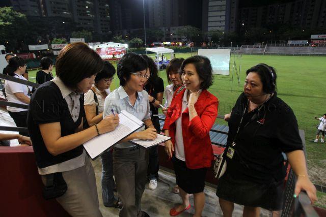 Tan Ming Li, daughter of presidential candidate Dr Tan Cheng Bock, being interviewed by the press during the waiting of presidential election result at Jurong East Stadium