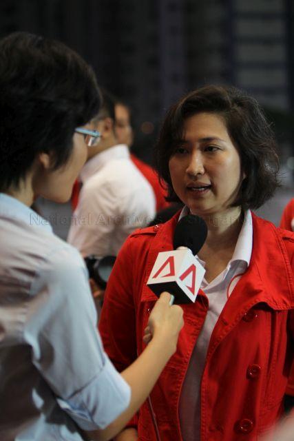 Tan Ming Li, daughter of presidential candidate Dr Tan Cheng Bock, being interviewed by Channel NewsAsia during the waiting of presidential election result at Jurong East Stadium
