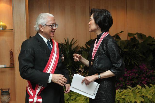 President Tony Tan Keng Yam chatting with Ambassador to the United States and &nbsp;recipient of Distinguished Service Order Medal Professor Chan Heng Chee during investiture of National Day awards at University Cultural Centre, National University of Singapore in Kent Ridge