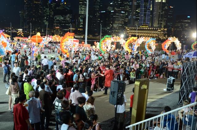 Visitors watching a performance during River Hongbao