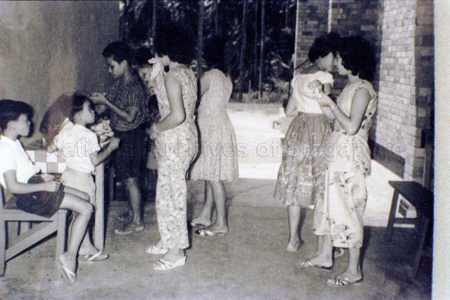 Old pictures of community centres in Singapore.