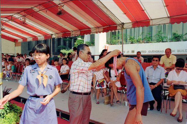 Singapore River Regatta at the Singapore River - Member of Parliament Abbas Abu Amin presenting medals to winners.