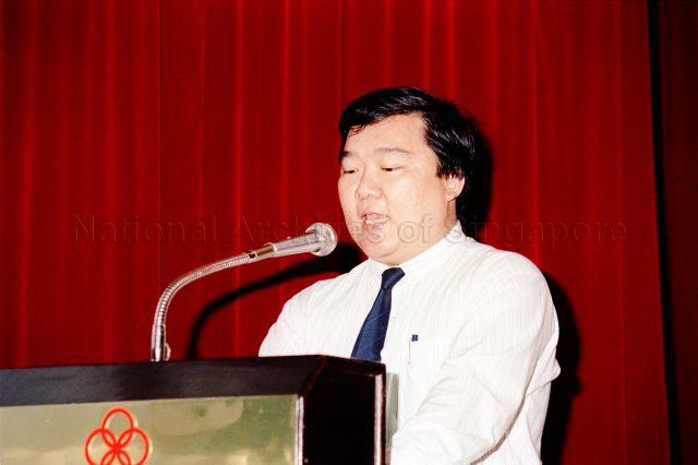 People's Association Youth Movement Flag Day Cheque Presentation Ceremony at People's Association Auditorium - People's Association official delivering a speech.