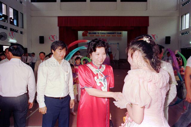 Solemnisation of Marriage at Yuhua Community Club - Member of Parliament Yu-Foo Yee Shoon shaking hands with the wedding couple.