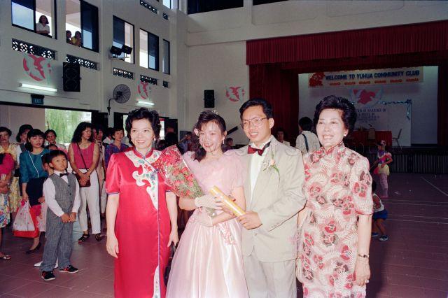 Solemnisation of Marriage at Yuhua Community Club - Group photo of Member of Parliament Yu-Foo Yee Shoon with the wedding couple.