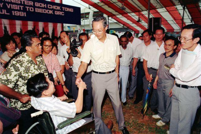 Community Visit to Bedok GRC - Prime Minister Goh Chok Tong shaking hands with residents, accompanied by Minister for Law and Home Affairs S. Jayakumar.