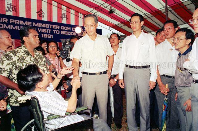 Community Visit to Bedok GRC - Prime Minister Goh Chok Tong shaking hands with residents, accompanied by Member of Parliament Hong Hai.