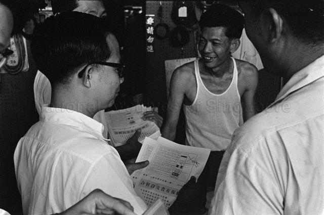 Deputy Prime Minister Toh Chin Chye distributing campaign leaflets