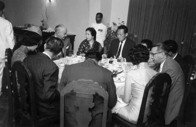 Puan Noor Aishah, Prime Minister Lee Kuan Yew and Chairman of Housing and Development Board Lim Kim San seated with guests