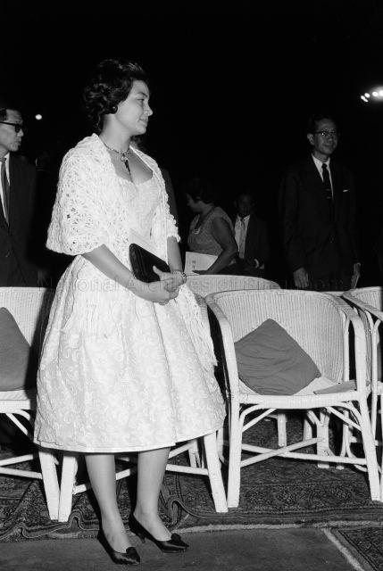 Visit to Singapore - Princess Norodom Monineath of Cambodia watching lion dance performance at the Istana Negara, with Minister for Home Affairs Ong Pang Boon in the background
