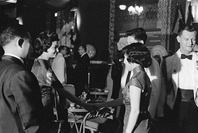 Visit to Singapore - Princess Norodom Monineath of Cambodia shaking hands with guests, along with Prince Norodom Sihanouk of Cambodia