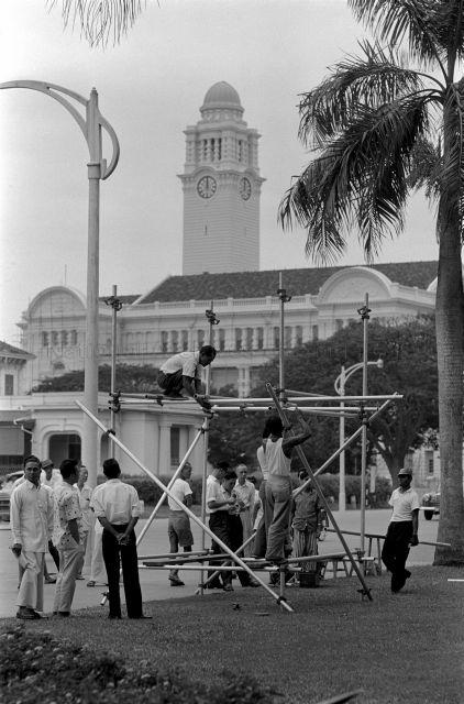 Workers setting up scaffoldings outside Empress Place