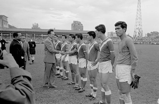 Football Association of Malaysia Cup Final at Jalan Besar Stadium - Prime Minister Lee Kuan Yew shaking hands with the players