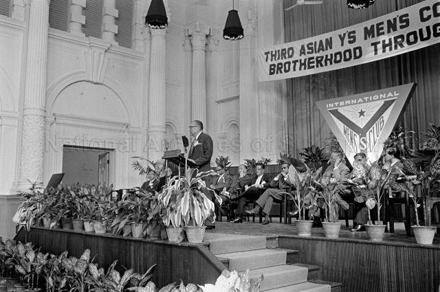 Third Asian Y's Men's Conference Brotherhood Through Y'sdom at Victoria Memorial Hall - Official delivering a speech, with Minister for Culture S. Rajaratnam seated on stage