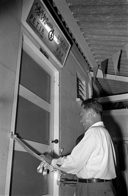 Opening of Lorong Tai Seng Clinic - Minister for National Development Tan Kia Gan officiating the ribbon-cutting ceremony