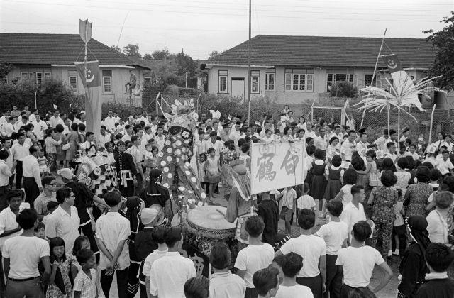 Visit to Serangoon Garden Constituency - Chinese lion dance performance welcoming the arrival of Prime Minister Lee Kuan Yew, accompanied by the Minister for National Development Tan Kia Gan