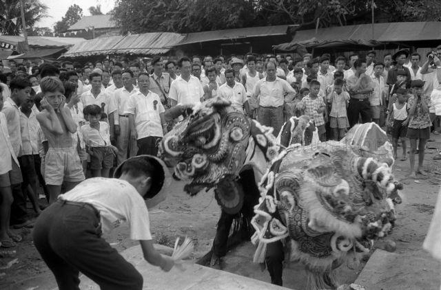 Visit to Serangoon Garden Constituency - Chinese lion dance performance welcoming the arrival of Prime Minister Lee Kuan Yew, accompanied by the Minister for National Development Tan Kia Gan