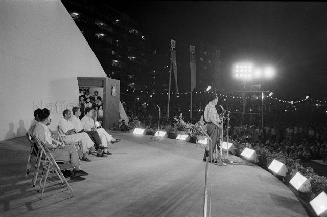 Visit to Chinatown areas (Pickering Street, Hong Lim Green) - Prime Minister Lee Kuan Yew delivering a speech, with Minister for Culture S. Rajaratnam, Minister for Finance Goh Keng Swee, Political Secretary for Ministry of Culture, Abdul Rahim Ishak, Parliamentary Secretary for Ministry of Finance S. Ramaswamy, Parliamentary Secretary for Home Affairs Chan Chee Seng and Political Secretary to Prime Minister, Jek Yeun Thong on stage