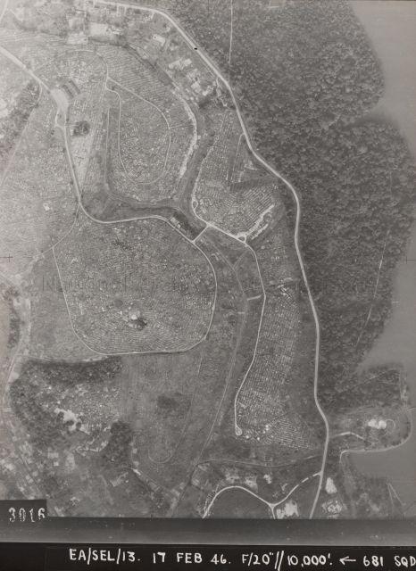 Aerial photograph showing part of MacRitchie Reservoir, Lornie Road, and Bukit Brown Cemetery