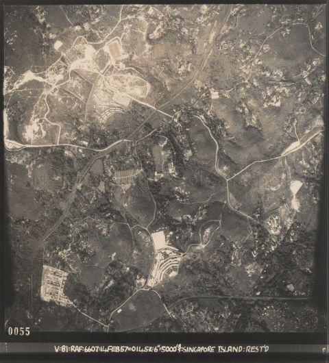 Aerial photo showing Ulu Pandan Camp with the 15 inch gun emplacements of Buona Vista Battery still clearly visible. No. 1 gun is in the camp beside a field. No. 2 gun is near the Ulu Pandan Military cemetery. At the bottom is the Malayan Railway. Between Ulu Pandan and Clemeti Roads, and below Ulu Pandan camp, is a hill called Panan IV or Hill 200 on old maps. On this hill in February 1942, soldiers of the Australian 2/4th Machine Gun Battalion died fighting against the Japanese. The Japanese finally allowed a burial party of the 2/4th from Sime Road POW camp to go to Hill 200 and bury their dead there on 21 December 1942, and 27 bodies were identified and buried.<br /><br />Aerial photo of Ulu Pandan. Rotate to place the inscription on the right for nearly correct orientation to north. The various landmarks are then as follows. Clementi Road is central, meandering south towards bottom centre; the Ulu Pandan canal flows from the bottom right corner to above centre on the left edge; the Malayan Railway line runs north-south close to the right edge. Also seen is Ulu Pandan Camp with the two 15-inch gun emplacements of Buona Vista Battery visible as small black circles with a white outline. No. 1 gun is in the hill-top camp beside a field, a little left of centre. This is currently a Police KINS Training Camp (2023). No. 2 gun is south-east of there, just to the east of the Ulu Pandan Military cemetery, which was laid out on a grid. Just north of this gun, parallel white lines show part of the former railway siding used to convey the heavy shells; its route is visible almost all the way from the main line, past this gun and terminating at No. 1 gun. The site of No. 2 gun is now occupied by Pine Grove condominium. Just east of No. 1 gun is a hill called Hill 200 in Mukim Pandan IV on old maps. On this hill in February 1942, soldiers of the Australian 2/4th Machine Gun Battalion died fighting against the Japanese. The Japanese finally allowed a burial party of the 2/4th from Sime Road POW camp to go to Hill 200 and bury their dead there on 21 December 1942, and 27 bodies were identified and buried.