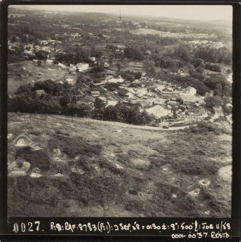Aerial view of Holland Village with a Chinese cemetery in the foreground