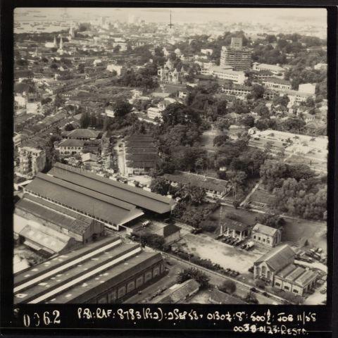 MacKenzie Road is visible in the foreground of this south-facing photo, with Singapore Traction Company Building partially seen in the bottom left. Further behind it is Chung Hwa Girls High School campus at 57 Niven Road. Further in the background along the middle of the image, we can see Eu Villa (Eu Tong Sen's mansion) and the adjacent skyscraper to its right is the Old Cathay Building.